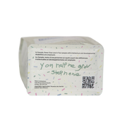 Bottom of Melly's Peru coffee bag with handwritten note, QR code, and charity registration details